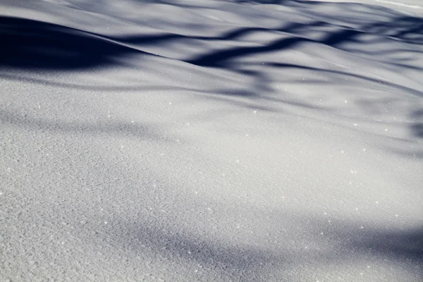 Snow background with stars and shadows — Stock Photo, Image
