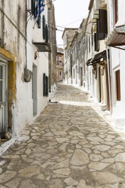 Picturesque alley in a mountain village on Corfu, Greece clipart