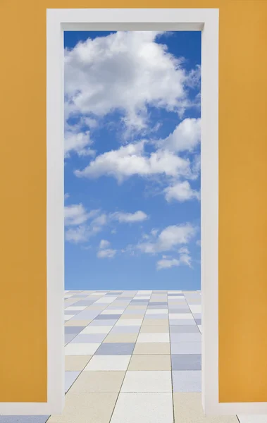 Door frame with cloudy sky and pavement — Stock Photo, Image