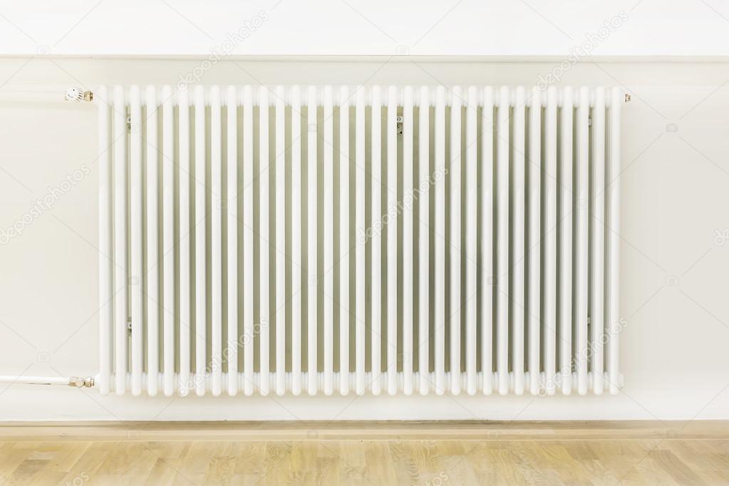 Heating system attached to a white wall
