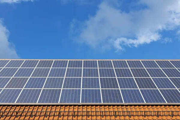 Solar panels on a new brick roof — Stock Photo, Image