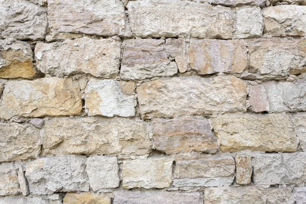 Pared de piedra marrón claro como fondo — Foto de Stock