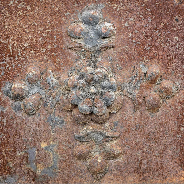 Rusty iron plate with rosette as background — Stock Photo, Image