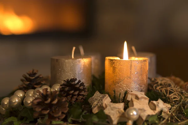 Burning candle on an advent wreath — Stock Photo, Image