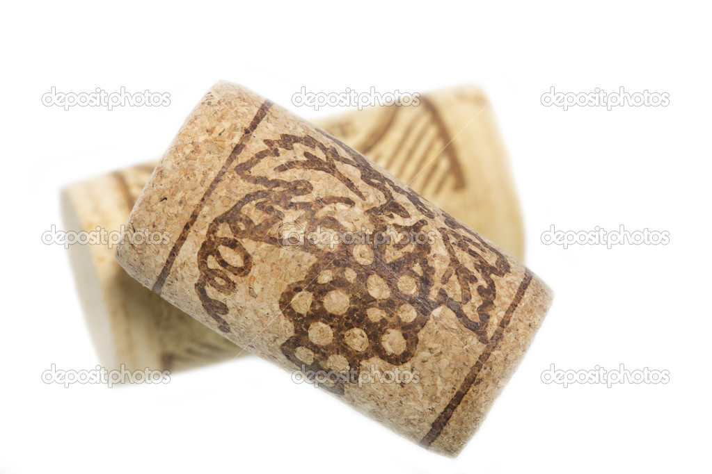 Two wine corks on white background