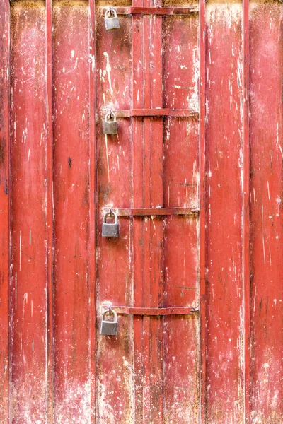 Cztery kłódek na drzwi metalowe — Zdjęcie stockowe