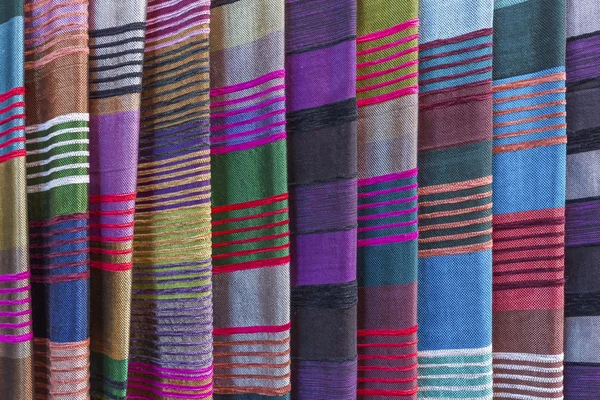 Colorful fabrics for sale on a market in Morocco — Stock Photo, Image