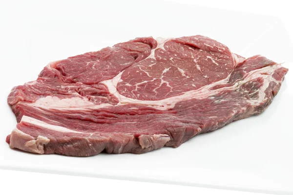 Single piece of ox loin on a white plate — Stock Photo, Image