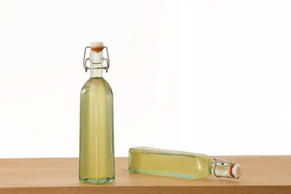 Bottles filled with elderflower syrup — Stockfoto