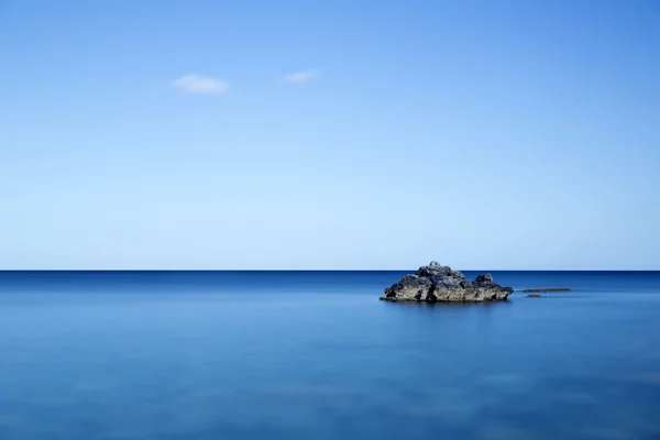 Rock in the sea, long time exposure — стоковое фото