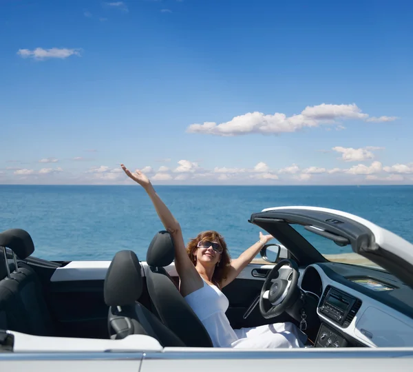 Woman in a white convertible — Stock Photo, Image