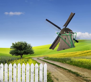 Traditional windmill in the countryside clipart