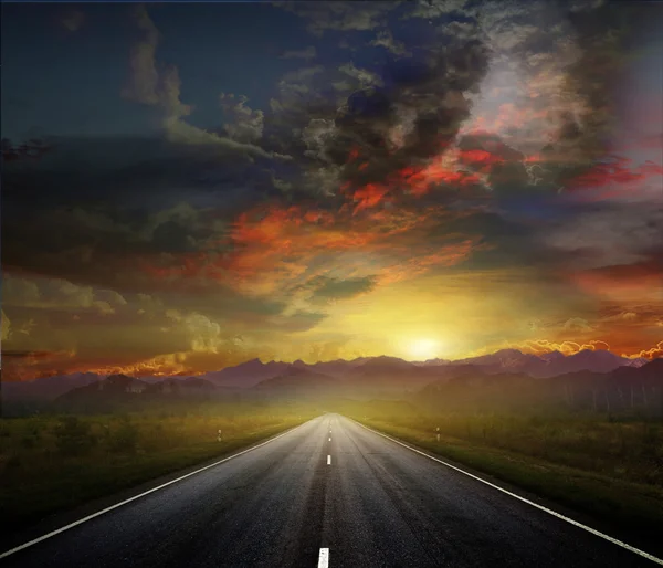 Country road with a dark sky — Stock Photo, Image