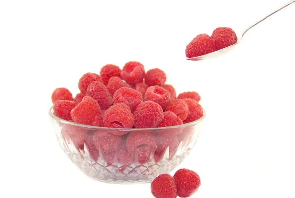 Delicious raspberries in a plate with a spoon — Stock Photo, Image