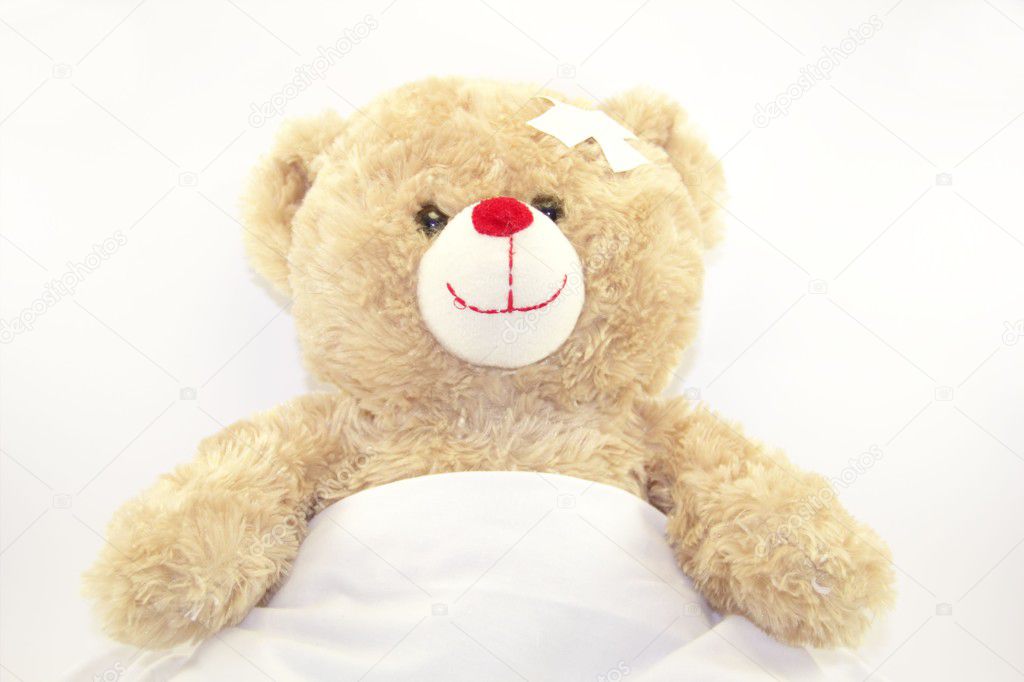 Smiling teddy bear is sicking