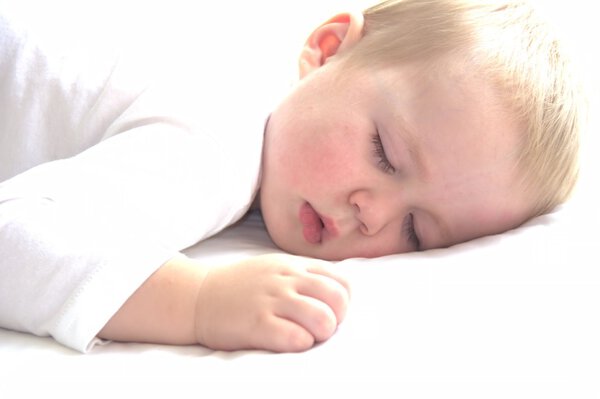 Little cute toddler boy is having a nap