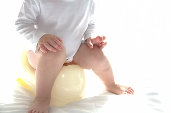 Child is sitting on the potty Royalty Free Stock Photos