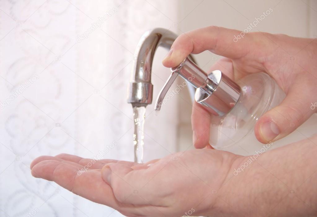 Man is washing his hands with hygiene hand wash