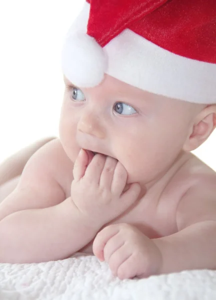 Lindo bebé en sombrero de año nuevo rojo —  Fotos de Stock