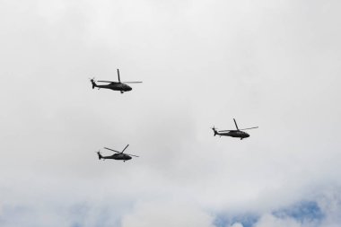 Three colombian police helicopters flying during independence day parade