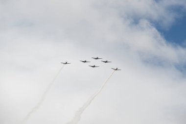 Super Tucano airplanes float flying over crowd during independence day