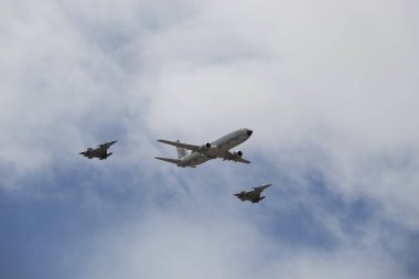 Two combat jets and one big airplane during colombian airforce show of independence day