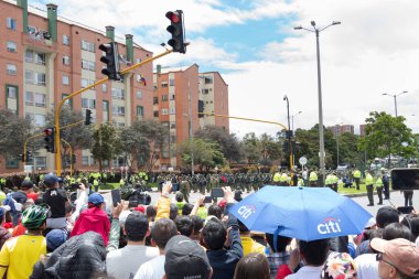 People watching Colombian Independence day Armed Forces parade in middle of Boyaca Avenue
