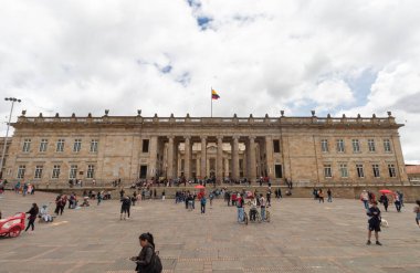 National Capitol building neoclassical architecture style with colombian waving flag. This buiding is located in south corner of Bolivar Square in downtown
