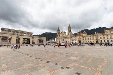 Bogota colombia main square knowed as Bolivar Square with Justice palace building and primatial cathedral at background  in sunny day  clipart