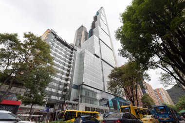 BD Bacata skycraper ground view at 19th street with vehicular traffic and cloudy day at background