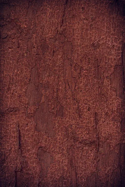 Tinta descascando em uma parede de madeira marrom velha Fotografia De Stock