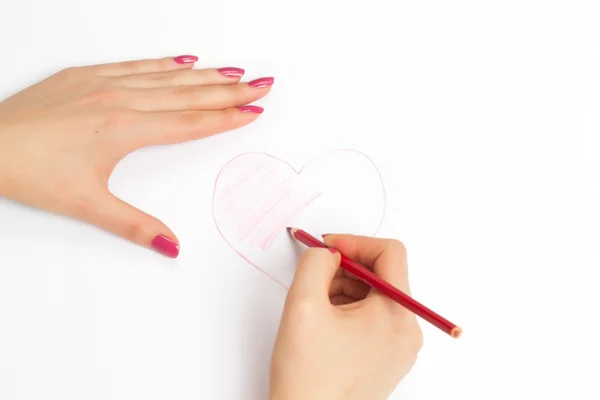 มือวาดหัวใจด้วยดินสอ — ภาพถ่ายสต็อก