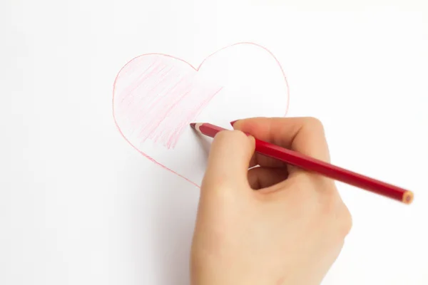 Manos pintando un corazón con un lápiz — Foto de Stock