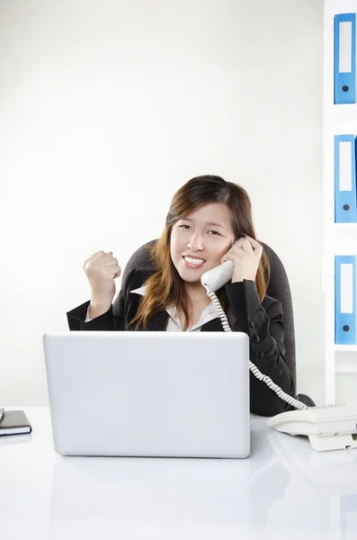 Businesswoman cheering on the phone — Stock Photo, Image