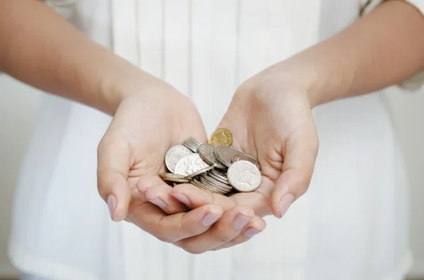 Holding coins — Stock Photo, Image