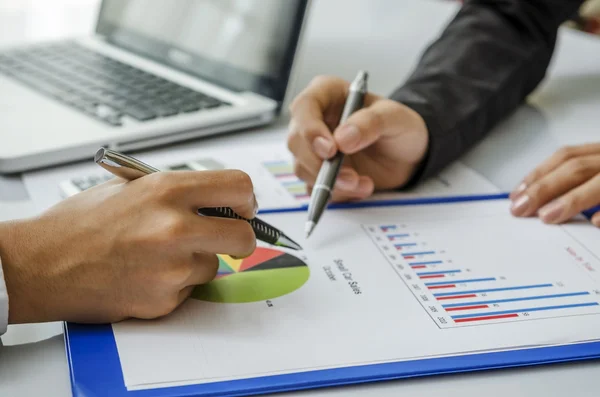 Meeting on chart — Stock Photo, Image