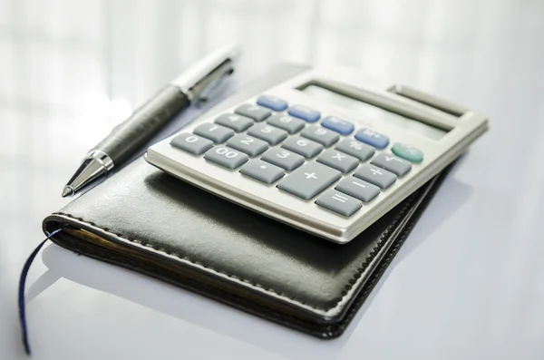 Calculator and diary — Stock Photo, Image