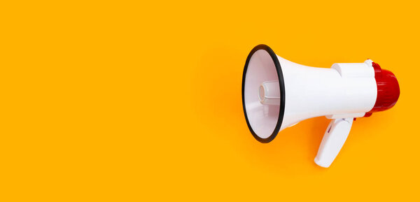 Red and white megaphone on orange background.