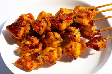 Chicken butt grilled on white background.