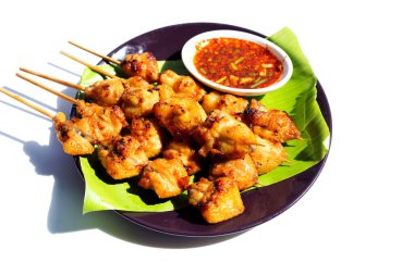 Chicken butt grilled on white background.