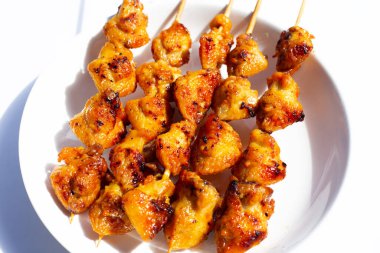 Chicken butt grilled on white background.