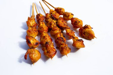 Chicken butt grilled on white background.