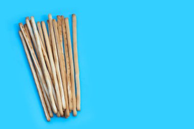 Bread sticks on blue background