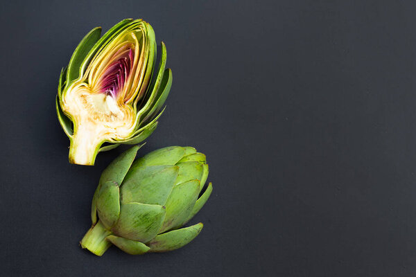 Fresh artichoke on dark background