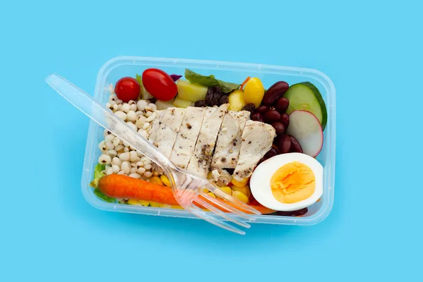 Salad with meat and vegetables in plastic package box