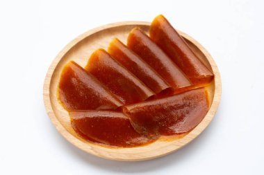 Dried mango paste sheets on white background.