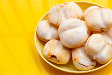 Toddy palm on yellow background.
