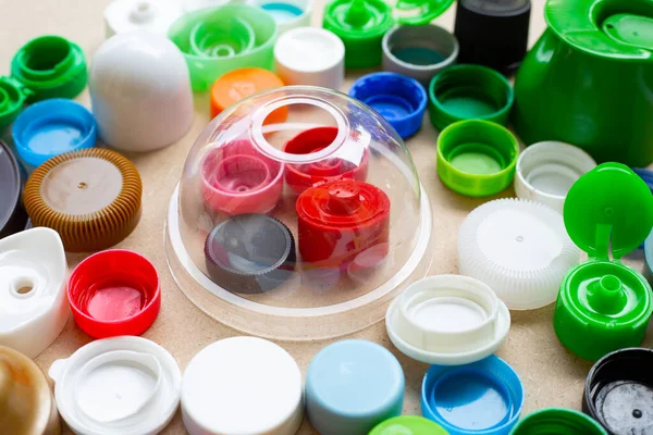 Colorful plastic bottle caps and plastic glass lid