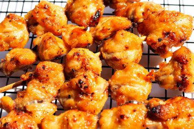Chicken butt grilled on white background.