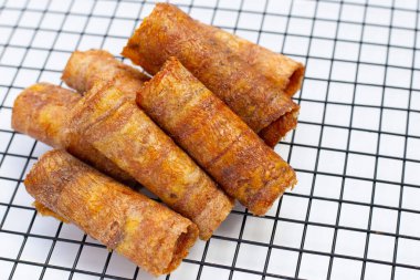 Sun dried banana roll snacks